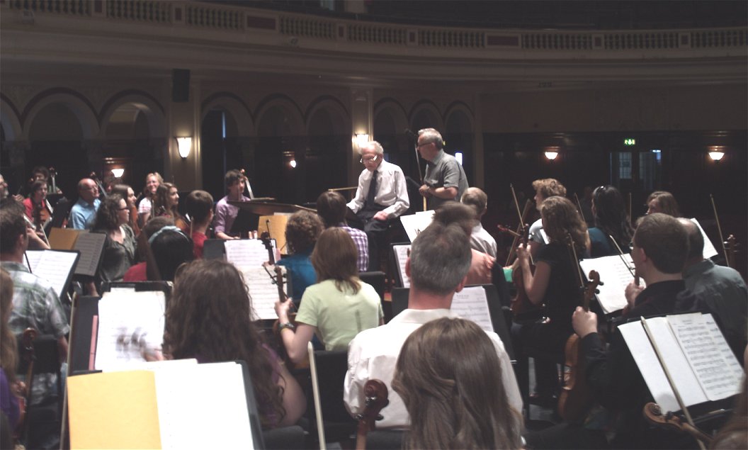 Arthur Burgan rehearses the orchestra