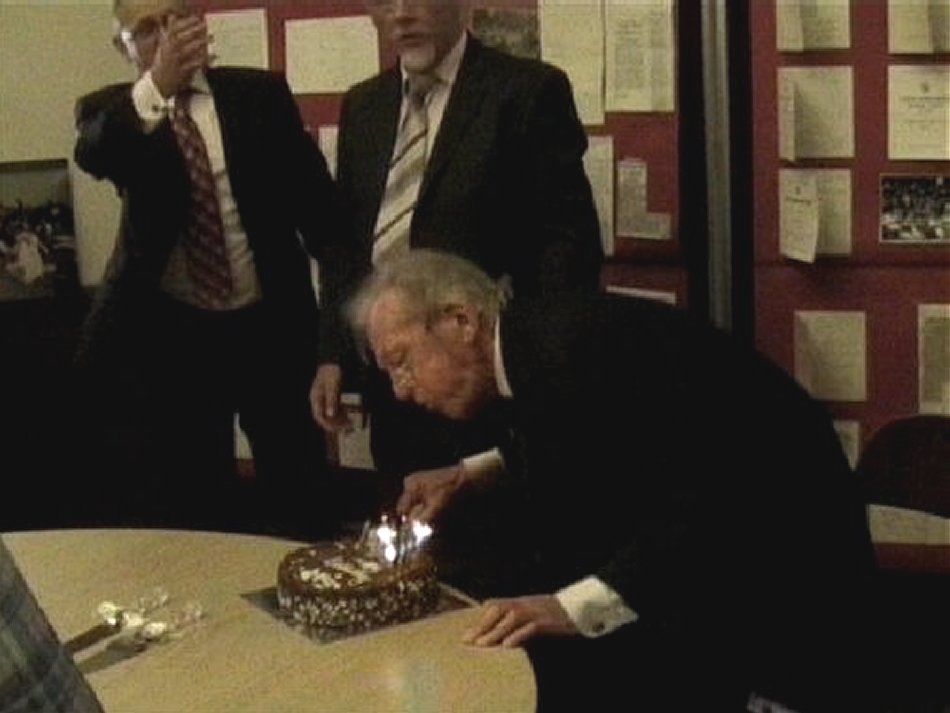 Arthur Burgan blows out the birthday cake candles